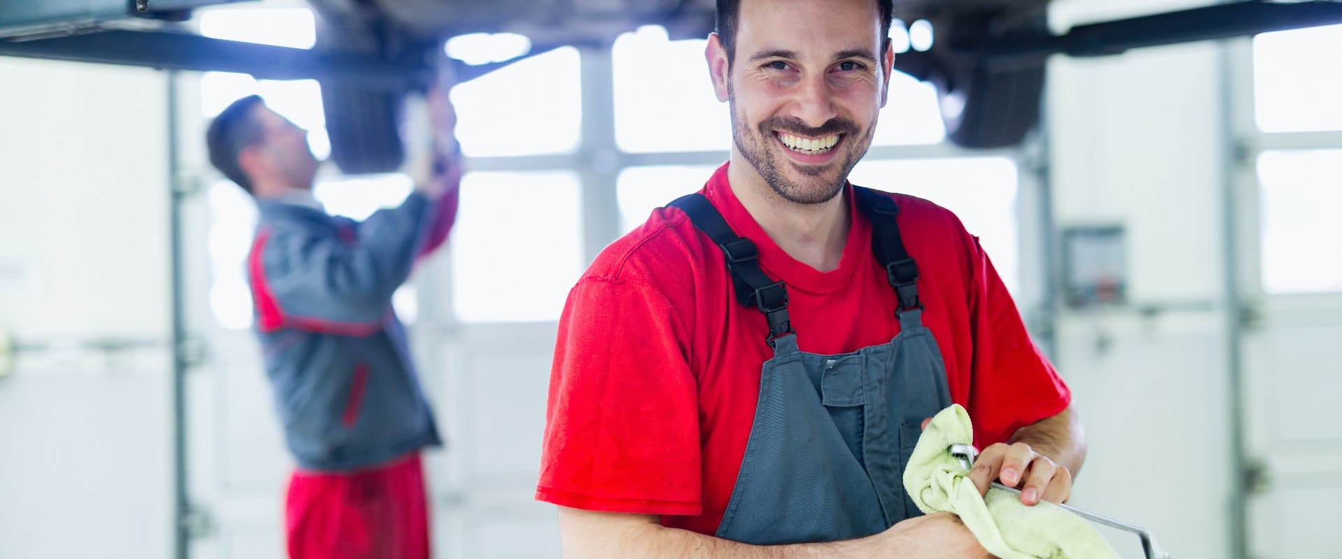 Car mechanic working at automotive service center